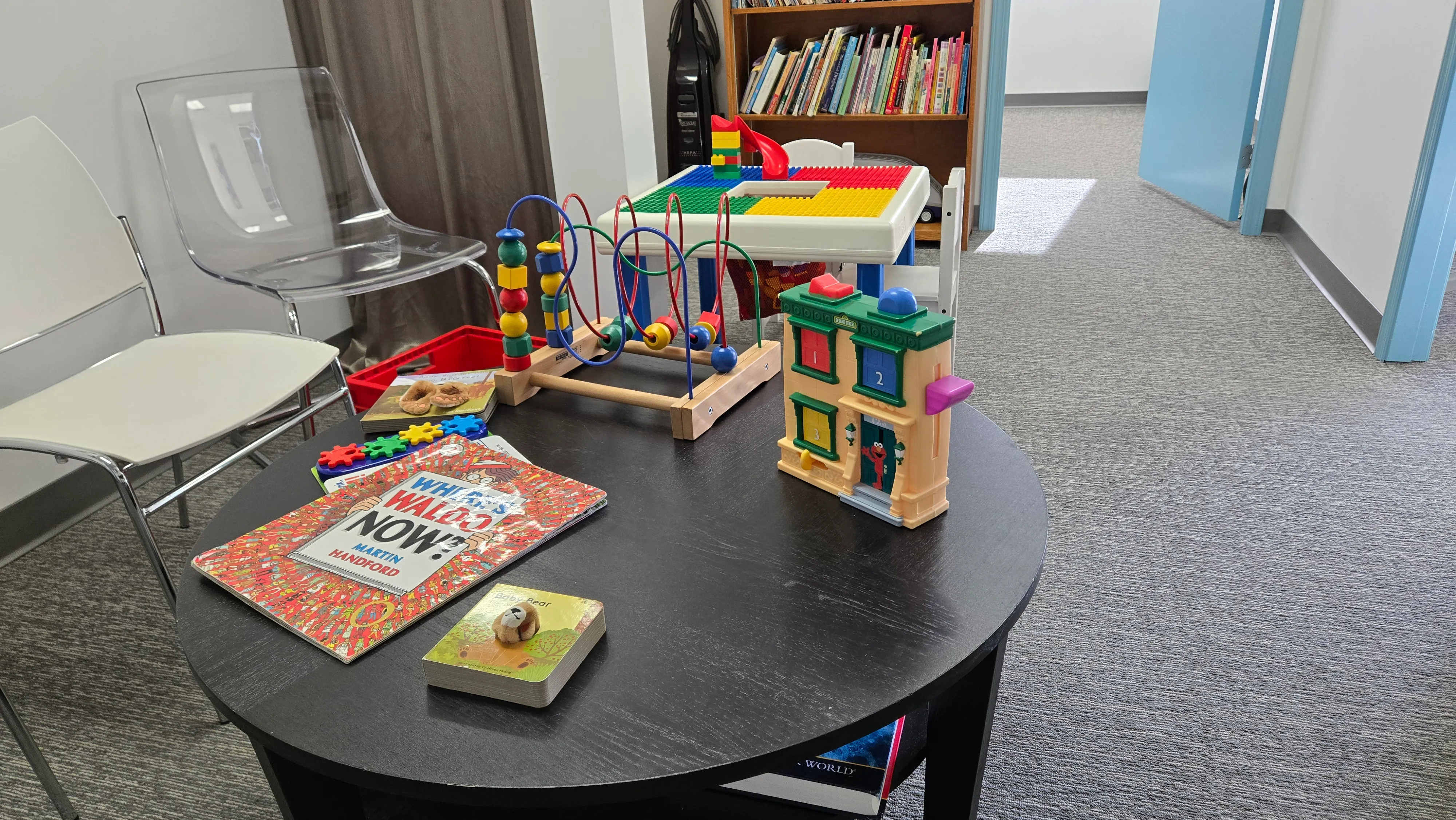 A therapy table set up with games and activities